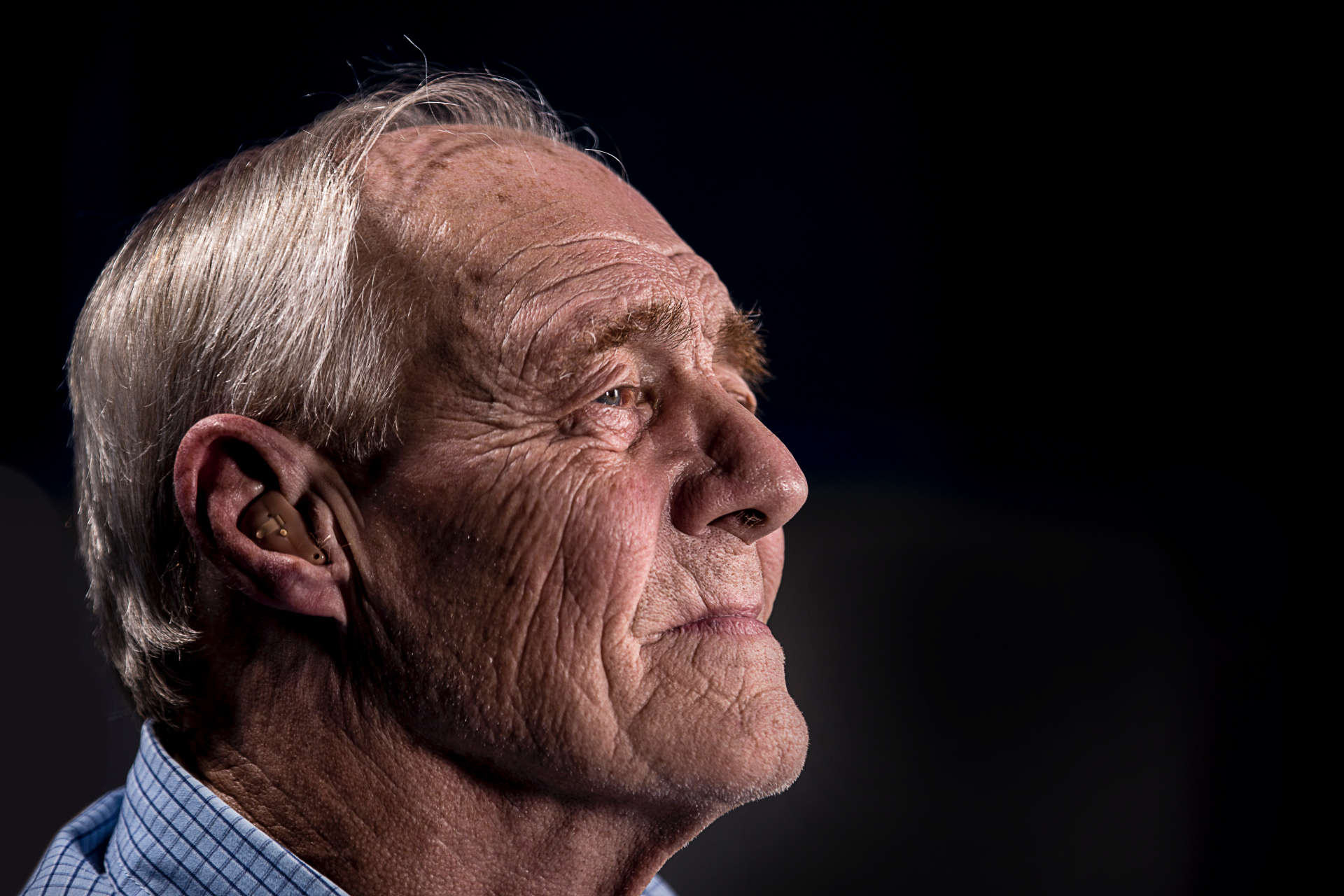 Elderly Man with Hearing Aid